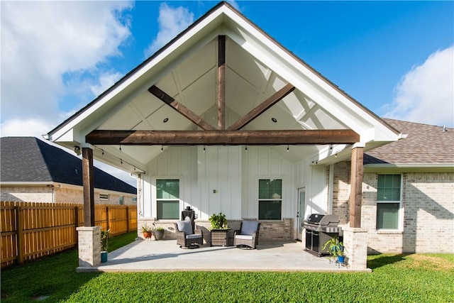 back of property featuring a patio, an outdoor hangout area, and a lawn