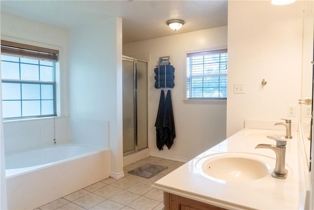 919 Alan Ln, Caldwell, TX 77836 - bathroom featuring tile patterned floors, a bath, a shower stall, and double vanity