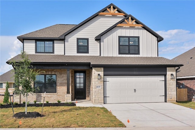 6308 Raleigh, College Station, TX 77845 - view of front facade featuring an attached garage, concrete driveway, a shingled roof, board and batten siding, and stone siding