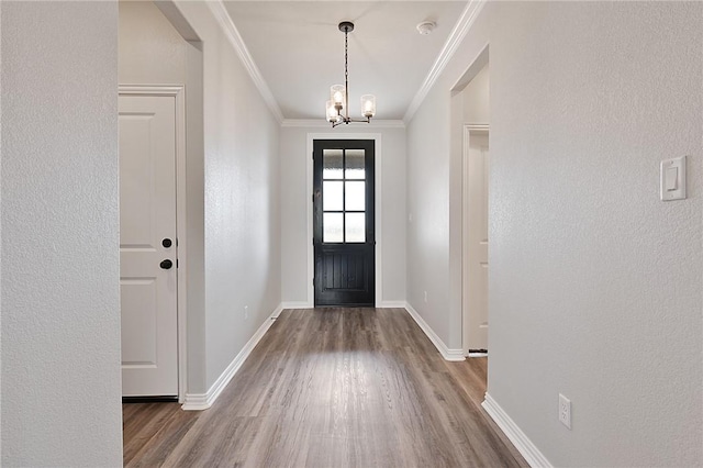 6308 Raleigh, College Station, TX 77845 - entryway with wood finished floors, crown molding, a chandelier, and a textured wall