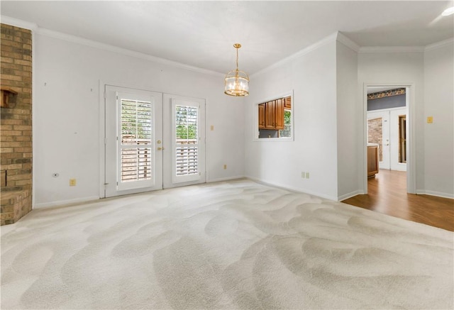 9300 Essex Grn, College Station, TX 77845 - unfurnished room featuring french doors, light colored carpet, crown molding, baseboards, and a chandelier