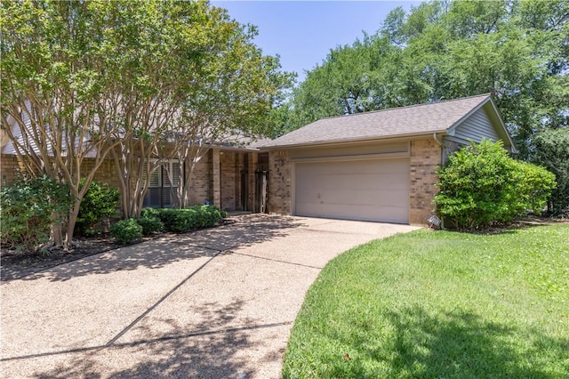 9300 Essex Grn, College Station, TX 77845 - view of front of house with brick siding, a garage, driveway, a front yard, and roof with shingles