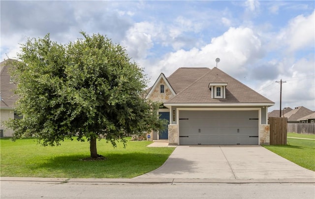 2031 Positano Loop, Bryan, TX 77808 - view of front of house with stone siding, concrete driveway, and a garage
