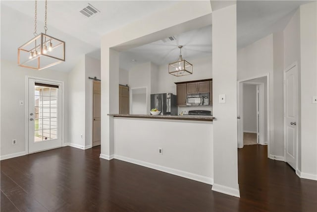 2031 Positano Loop, Bryan, TX 77808 - kitchen featuring freestanding refrigerator, a chandelier, lofted ceiling, dark wood-style flooring, and pendant lighting