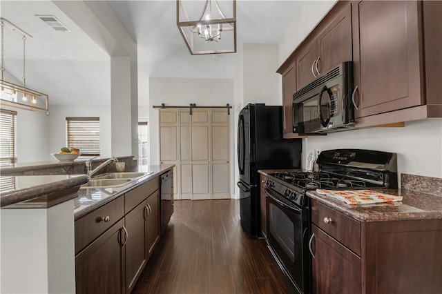 2031 Positano Loop, Bryan, TX 77808 - kitchen featuring black appliances, a sink, dark wood finished floors, and decorative light fixtures