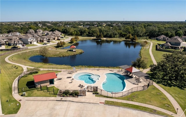 2031 Positano Loop, Bryan, TX 77808 - drone / aerial view of a pool area and a large body of water