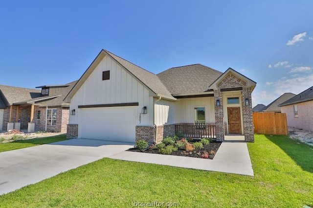 view of front of home featuring a front lawn and a garage