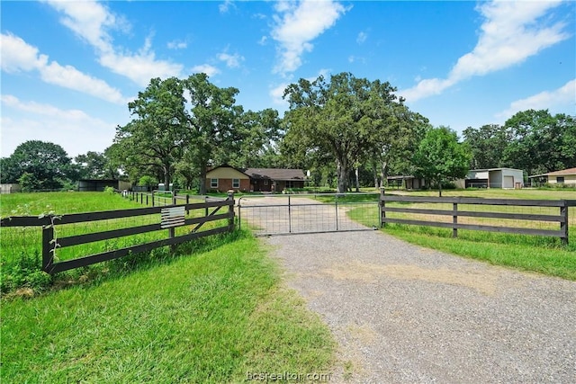 view of gate featuring a lawn