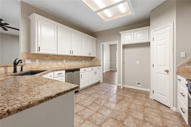 kitchen with a sink, stainless steel dishwasher, backsplash, and white cabinets