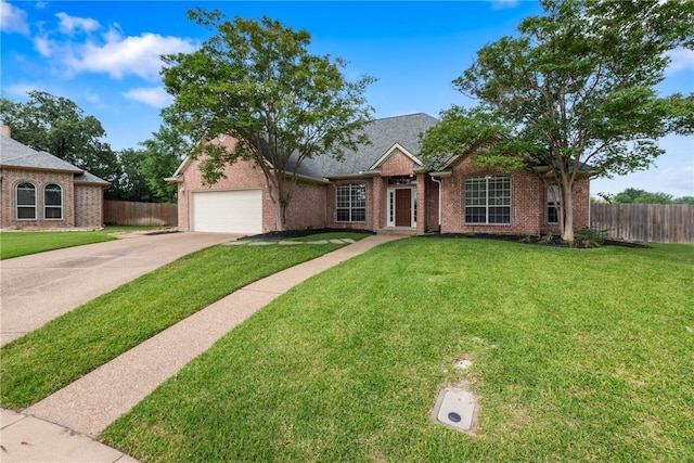 view of front of property featuring a garage, driveway, and brick siding