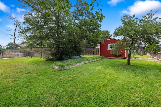 view of yard with a storage shed and an outdoor structure