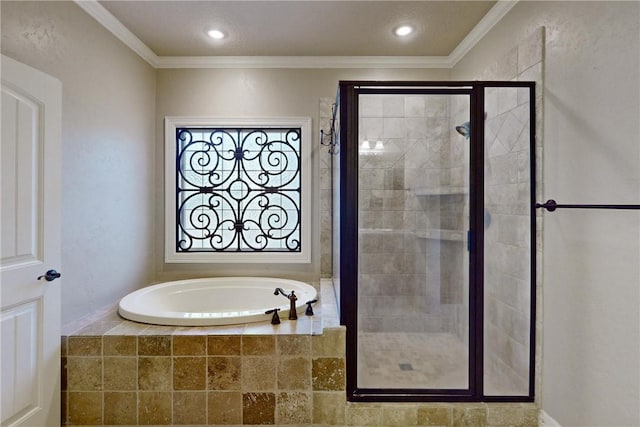 bathroom featuring ornamental molding and independent shower and bath