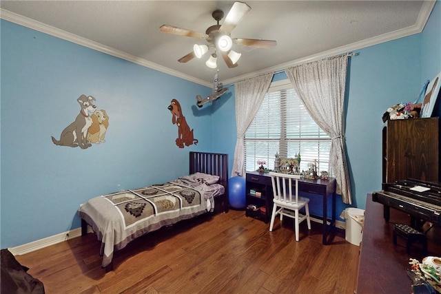 bedroom with dark hardwood / wood-style floors, ceiling fan, and ornamental molding