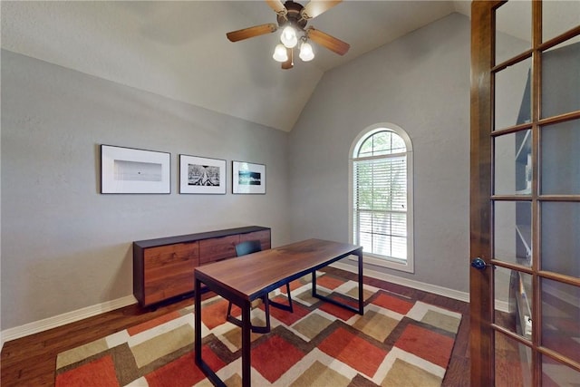 home office with ceiling fan, dark wood-type flooring, and lofted ceiling