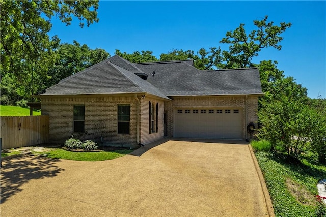 single story home featuring a garage