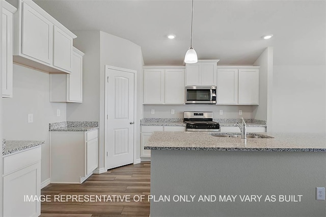 kitchen featuring hardwood / wood-style flooring, sink, white cabinetry, and stainless steel appliances