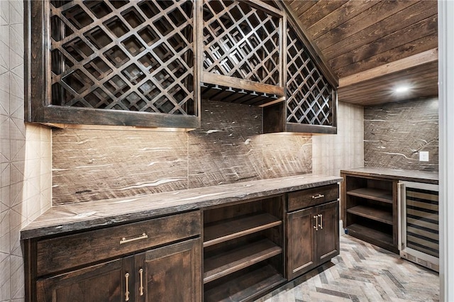 4724 Concordia Dr, Bryan, TX 77802 - wine cellar with wood ceiling, a bar, and wine cooler