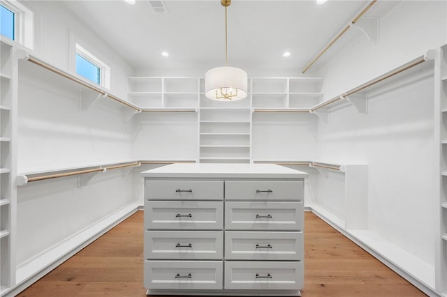4724 Concordia Dr, Bryan, TX 77802 - spacious closet with light wood-type flooring and visible vents