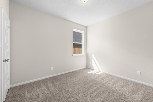 spare room featuring carpet flooring