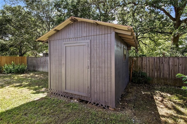 view of shed with a fenced backyard
