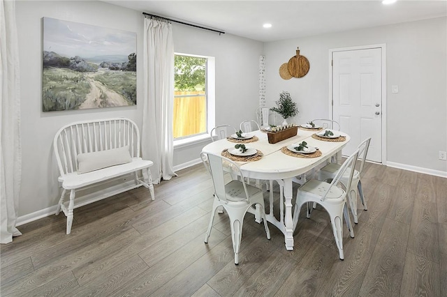 dining area featuring baseboards, recessed lighting, and wood finished floors