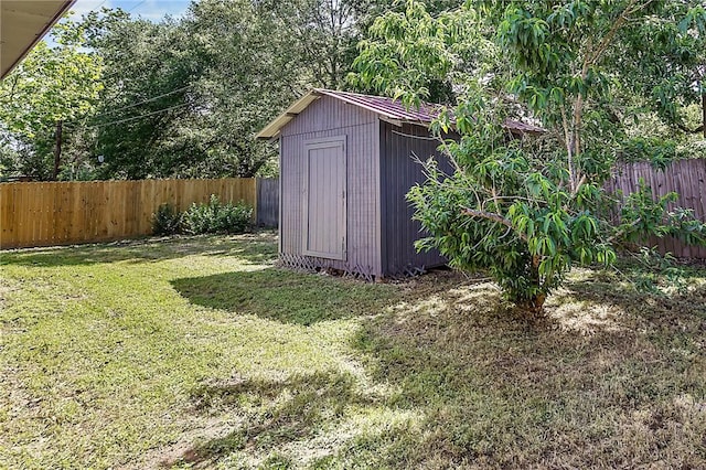 view of shed with a fenced backyard