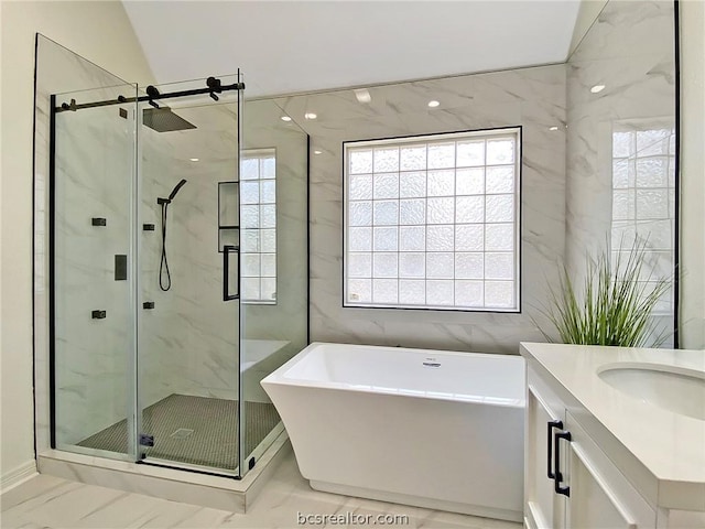 bathroom with plus walk in shower, vanity, and vaulted ceiling