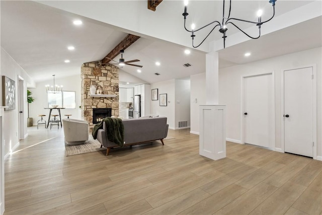 3012 Monument Dr, Round Rock, TX 78681 - living area featuring a chandelier, light wood-style flooring, a fireplace, a ceiling fan, and recessed lighting