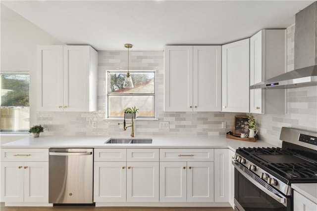 3012 Monument Dr, Round Rock, TX 78681 - kitchen with stainless steel appliances, wall chimney range hood, white cabinets, and decorative backsplash