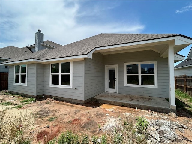 3140 Charge Ln, Bryan, TX 77808 - back of property featuring a chimney and a shingled roof