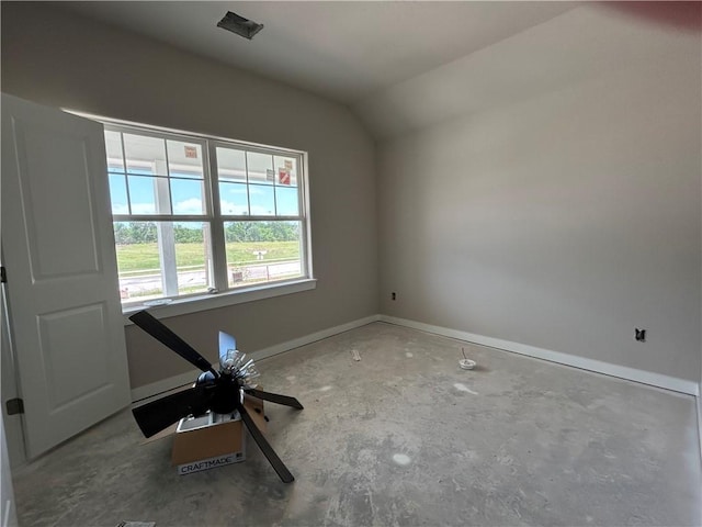 3140 Charge Ln, Bryan, TX 77808 - empty room with unfinished concrete floors, baseboards, and vaulted ceiling