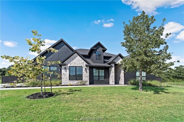 craftsman inspired home with a front yard