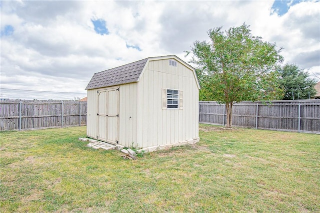 view of outbuilding featuring a lawn