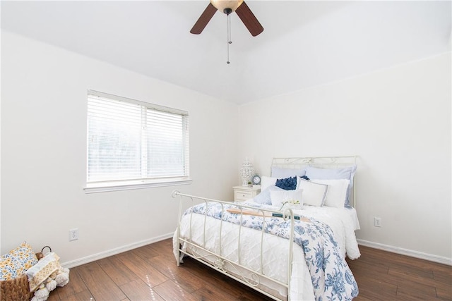 bedroom with ceiling fan and dark wood-type flooring