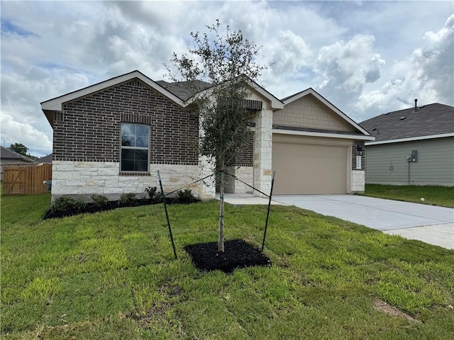 view of front of property featuring a garage and a front yard