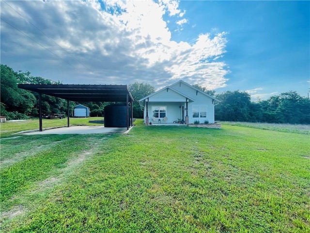 1692 Henry Prairie Rd, Franklin, TX 77856 - view of home's exterior with a storage shed, a lawn, and driveway