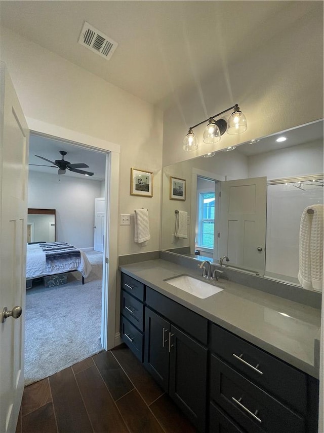 1692 Henry Prairie Rd, Franklin, TX 77856 - ensuite bathroom featuring vanity, wood finish floors, and a ceiling fan