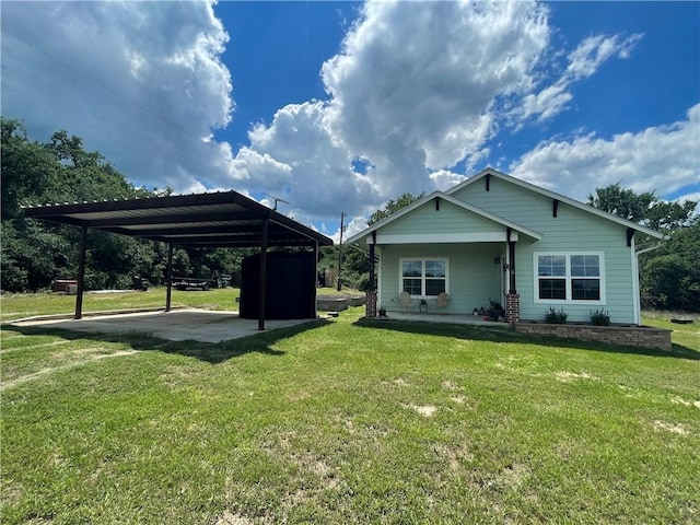 1692 Henry Prairie Rd, Franklin, TX 77856 - back of house with a lawn, a carport, and a porch
