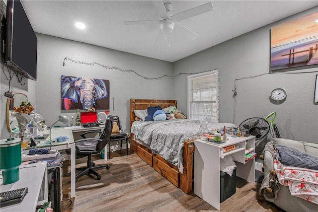 bedroom featuring ceiling fan and light hardwood / wood-style floors