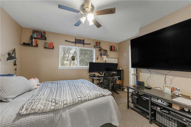 bedroom with ceiling fan and light carpet