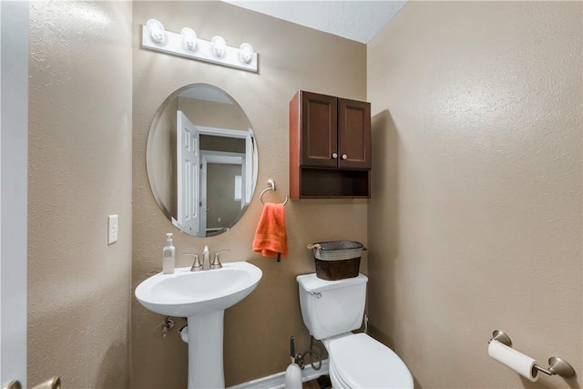 bathroom with sink and toilet