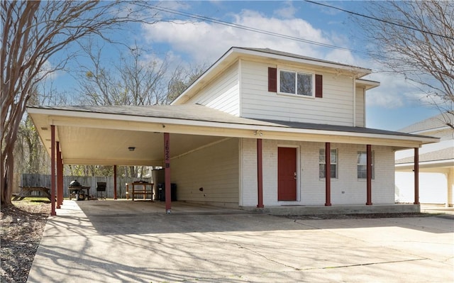 view of front of home featuring a carport and a porch