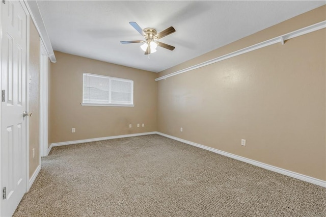 carpeted empty room with ceiling fan