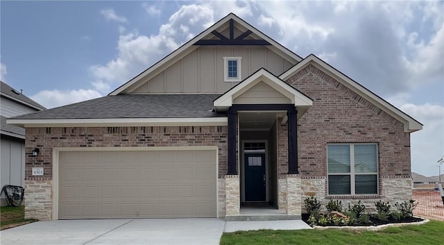 6303 Raleigh Dr, College Station, TX 77845 - craftsman-style house with board and batten siding, driveway, a garage, roof with shingles, and brick siding