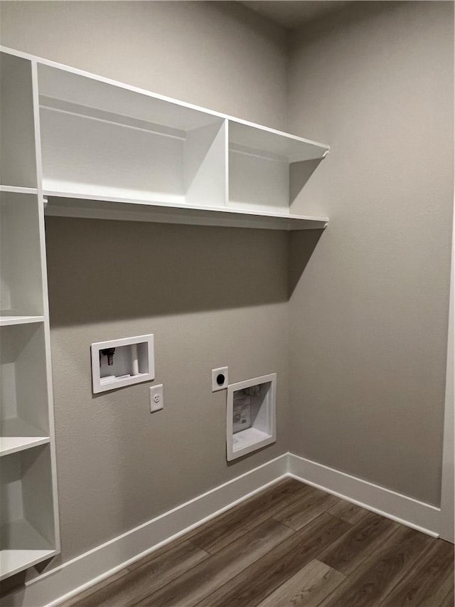 6303 Raleigh Dr, College Station, TX 77845 - laundry area with hookup for an electric dryer, dark wood-type flooring, washer hookup, and baseboards