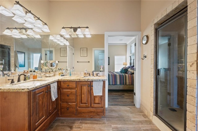 bathroom featuring wood-type flooring, vanity, and an enclosed shower