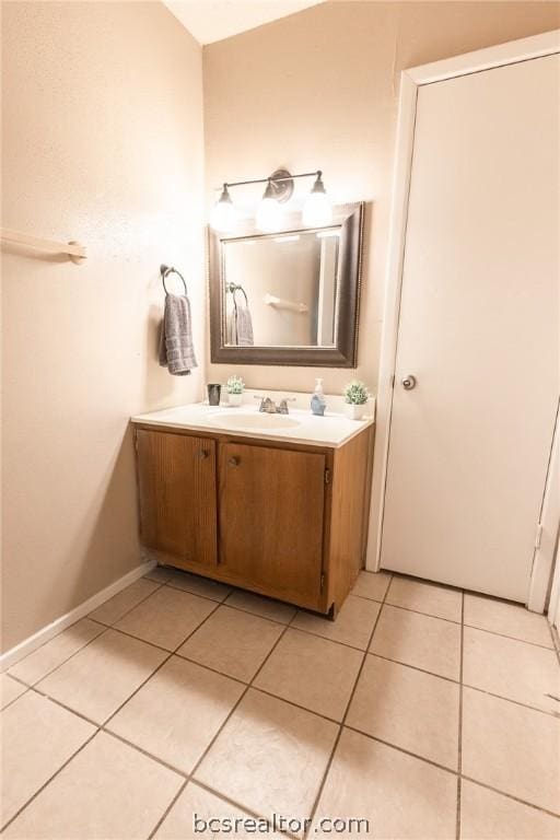 bathroom featuring tile patterned flooring and vanity