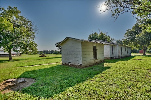 view of property exterior featuring a yard