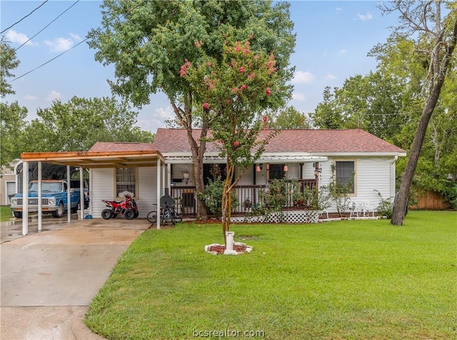 ranch-style home with a front lawn, a porch, and a carport