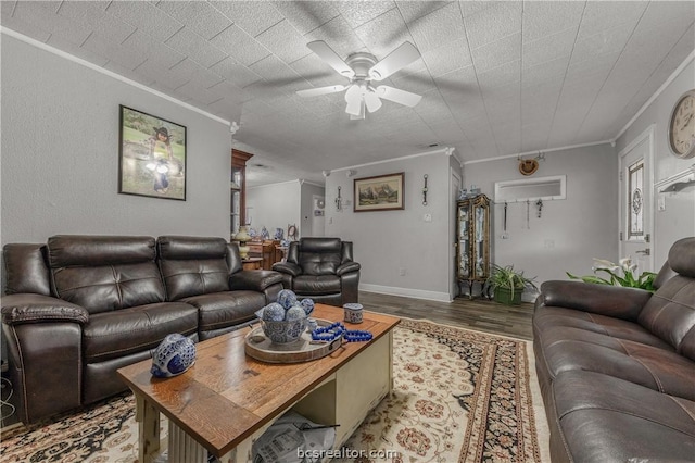 living room featuring ceiling fan, crown molding, and hardwood / wood-style flooring